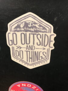 Photo of a decal that says 'GO OUTSIDE AND DO THINGS