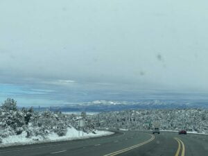 Snowy landscape with mountains in the distance helps people find peace and comfort in nature by simple living