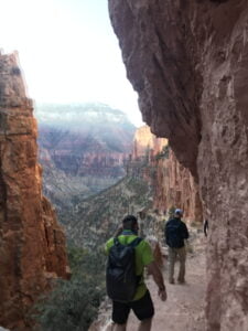 People walking along a path in the Grand Canyon