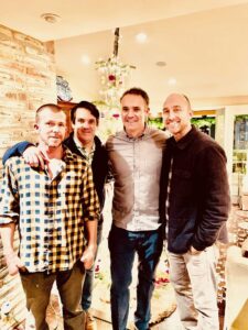 Motivational speaker, Matt Miller, poses for picture with friends