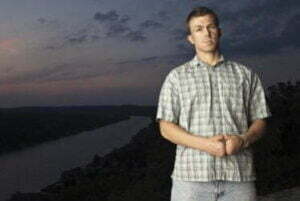 Matt Miller with a backdrop of a darkened landscape post-sunset