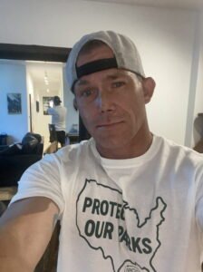 Indoor selfie of Matt Miller wearing a hat